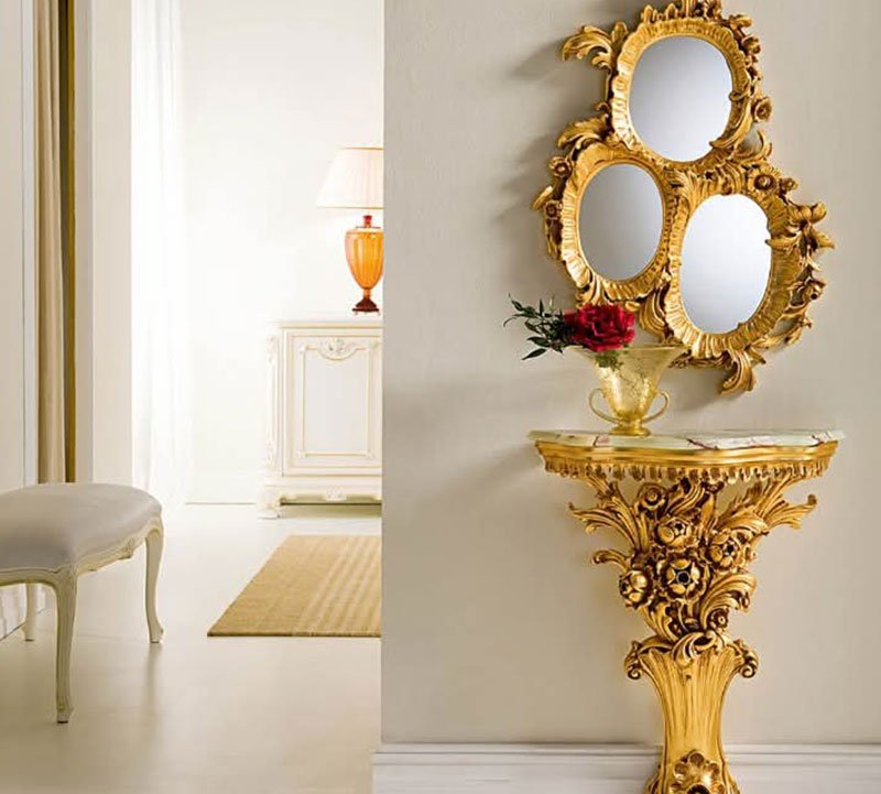 A regal gold-leaf console and mirror ensemble, perfect for adding classical elegance to any hallway or foyer.